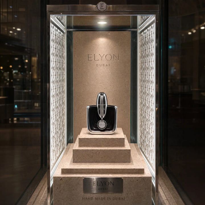 Elyon Dubai Himeros perfume bottle displayed in an illuminated vitrine